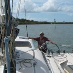 Steve at the helm. Negotiating shallows on the way to Gold Coast.